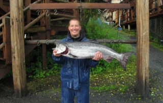 Guest holding a large salmon