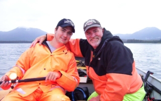 Father and son on fishing boat
