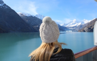 A woman looking at the Inside Passage and thinking about Alaska Interesting Facts.